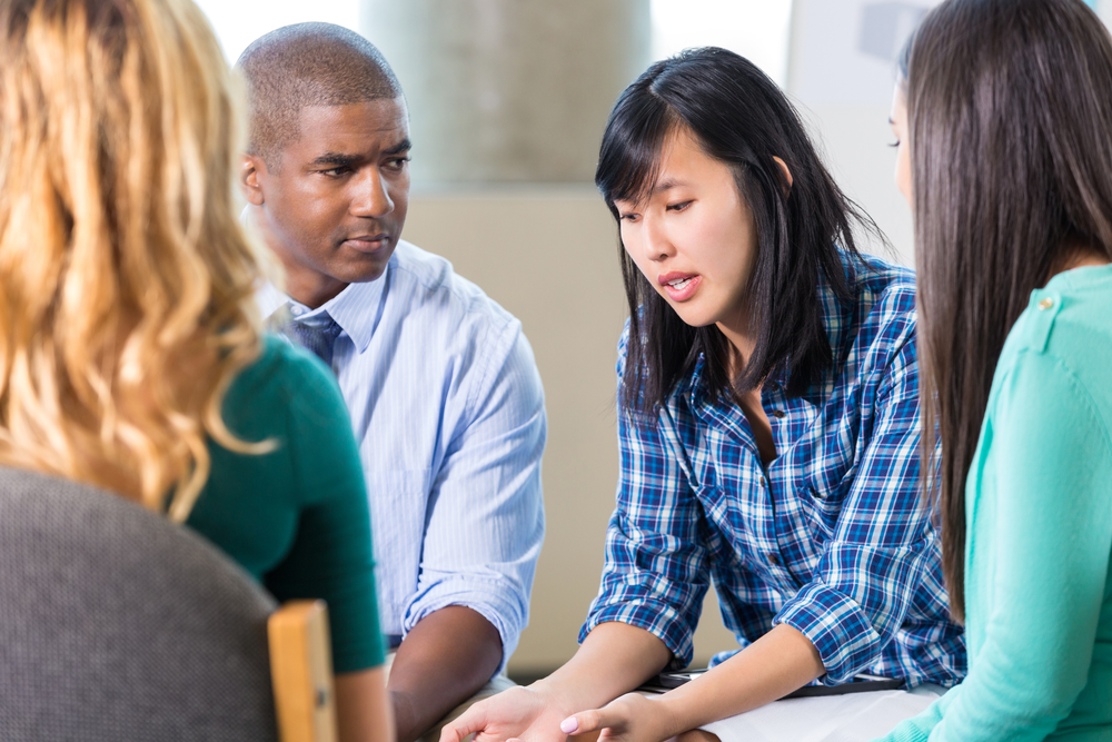 Counselor with students in school setting